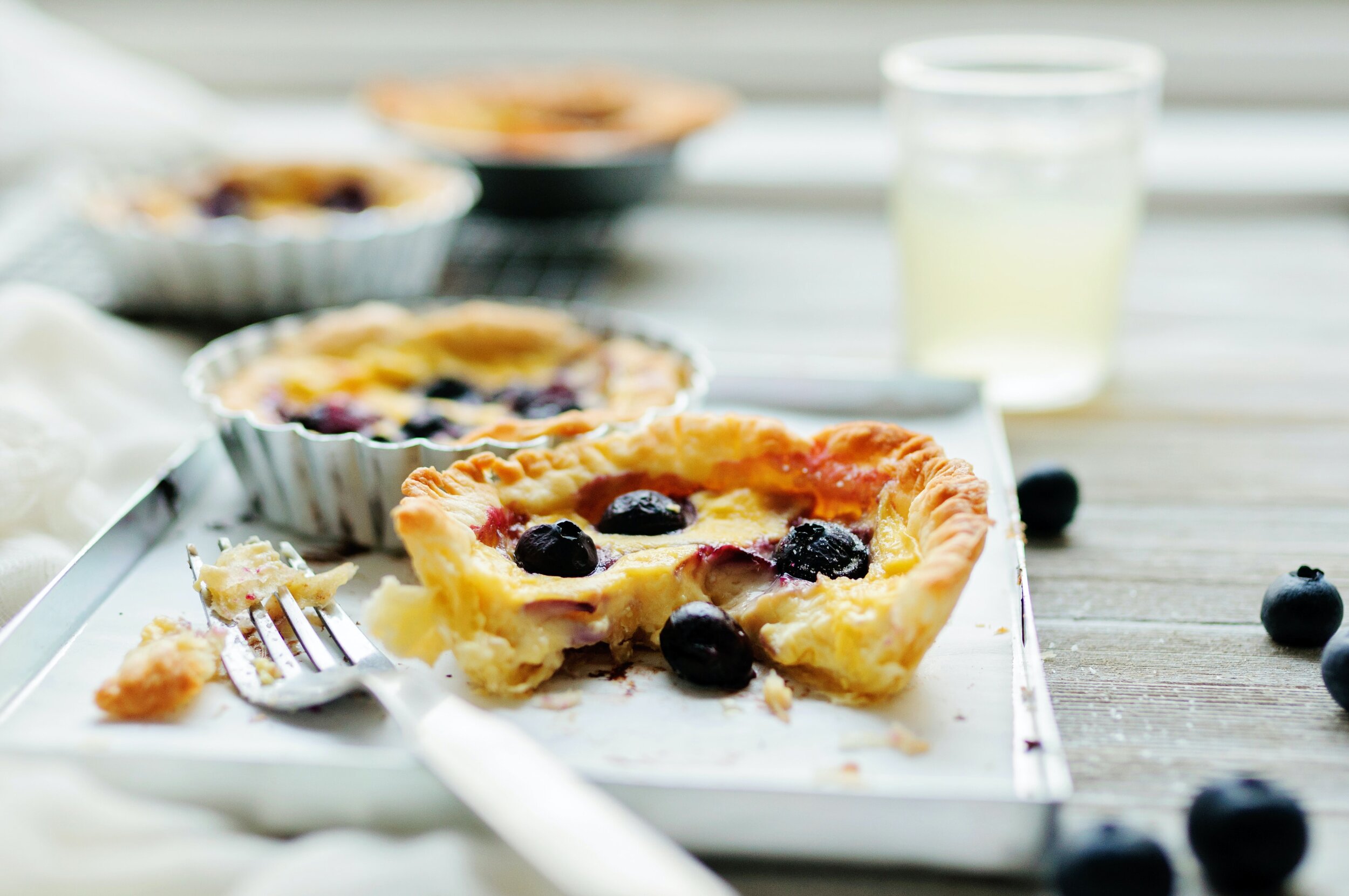 blueberry tarts with fork