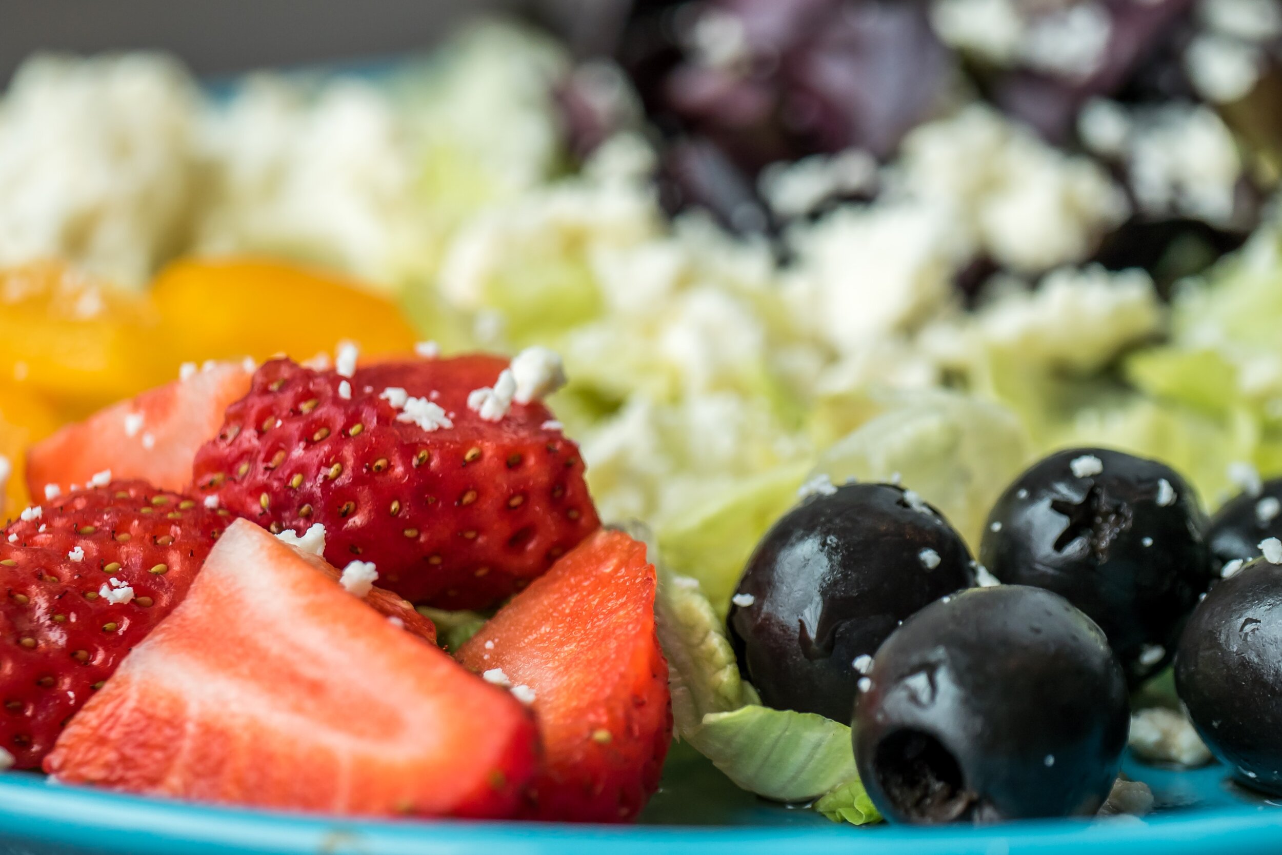 strawberries and olives with salad