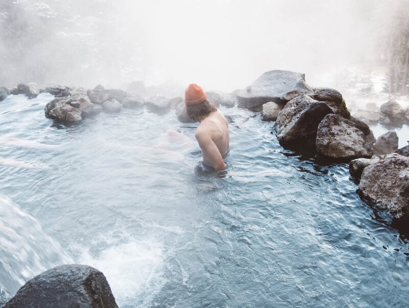 guy in hot spring by the mountain
